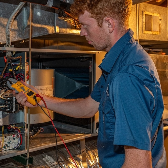 Technician troubleshooting and ensuring cohesion with industry-standard HVAC practices.